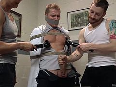 A guy finds himself completely helpless as two angry horny cocks have tied him up in a fierce rope bondage and have also mouth gagged him. Watch the tattooed man sucking nipples and performing a passionate and intense blowjob. The atmosphere gets even hotter as the dirty game is completed by vibrators.