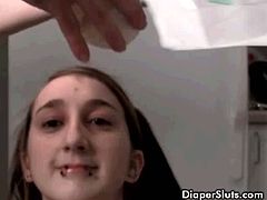 Piss drinking slut shows kinky moves on camera. This teaser surely has smooth pussy ready for anything  to satisfy us  with her fantasies. Young teen slut drinking her piss from diaper.