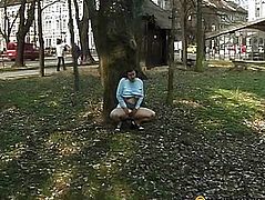 Chick takes off her pants in a tree