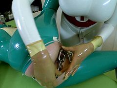 Clanddi and Lucy pet each other in a weird latex fetish clip