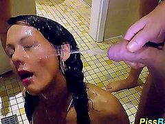 Pretty urine swallower gets drenched in goldenshower pee streams