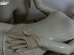 Two lovely sluts are touching themselves after dressing up in white latex costumes..