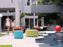 Brunette beauties Breanne Benson and April O'Neil get naughty by the pool before moving the fun inside and adding a hard cock to the party to fuck them both