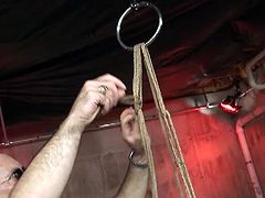 This master is punishing his brunette slave and spanking and anchoring her ass and clips her tits in this free tube video.