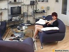 Woman on the couch touching the rubber member