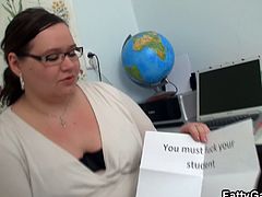 This teacher being naughty wanting to play a game and she picked a daring game of making her fuck one of her young student and here she sucked his big cock and got fucked in her cubicle.