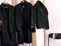 Nicole and another blonde are trying on leather coats. They take off their bras to feel the leather on their bare skin. Nicole does it first and then the other one.
