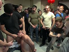 Nasty guys hold some BDSM party session every weekend and here comes the stud newbie as he got himself initiated as he was punished and fucked by them with many dudes watching.