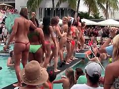 Lots of topless amateur hotties at a pool party