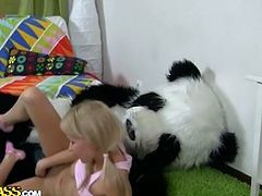 Girl plays big sex toy attached to panda mascot