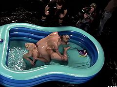 Two sexy blondes get all oiled up and fucked hard in an inflatable.