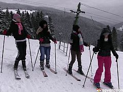 Babes on a ski trip play some lesbian sex games in the lodge