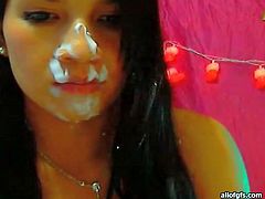 Pretty web cam girl sucks sex toy and takes fake cumshots