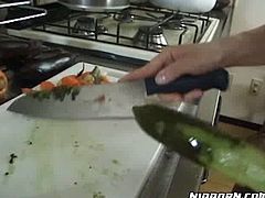 Nasty Asian bitch fucks her heavily hairy kitty with cucumber at kitchen