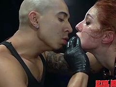 Don't pity this slutty redhead slave, for she loves the rough treatment, she has been persuaded to accept. Click to see tattooed Rose Red sucking cock, while her lusty cunt gets fingered deeply by a fierce executor. Watch her getting mouth fucked without mercy and then, banged hard from behind!