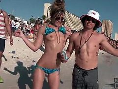 Babes at a busy beach shake their asses