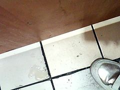 Korean girl sucks cock in a bathroom gloryhole and gets cum