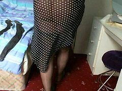 Naughty old crossdresser masturbates in stockings.