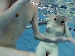 Nude girls filmed swimming underwater