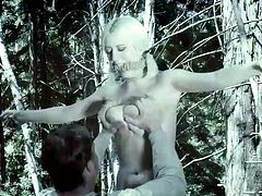 A perverse guy has found slutty Cherry and tied her in a strong creative rope bondage, in the woods. The naked babe with nice big boobs has also been gagged, so no one could hear her terrifying screams. Watch her cunt fingered with anger and lust!
