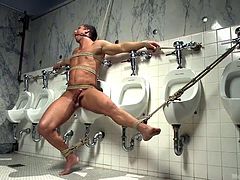 A hot stud got tied up and bonded with rope. Click to watch the dominant gay guy with beard, giving head with fervor, on his knees, in a public toilet. See the naked man tortured and gagged. Have fun!
