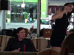 All the clients turn their heads, as the atmosphere gets really inciting in a local bar. Lullu is naked and obliged by a brunette hot bitch to suck a guy's dick. See the slutty babe entertaining the horny men at her table. Enjoy the kinky scenario!