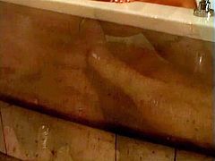 Busty blonde deepthroats a hard white cock in bath and fuck it