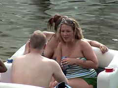 Bikini-clad brunette with a great body flashing her tits and pussy in public