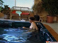 She relaxes in the hot tub then fucks her pussy with a toy