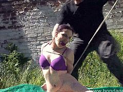 Outdoor bondage and cloth gagging of dominated submissive Ca