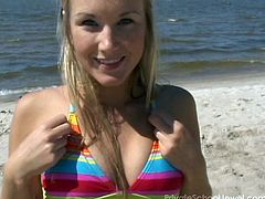 Bikini teen strips on the beach and hula hoops in the nude