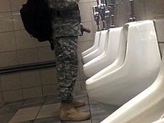 Soldier hardon in public bathroom.