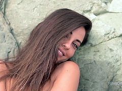 Lorena's nude body is simply perfect. This tall goddess wearing only a pair of pearly earrings has small lovely tits. Click to watch her masturbating on the sandy shores, as the wind plays with her long brown hair.