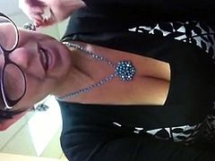 Mature woman masturbating while at work