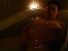 Masturbating Cougar in a Candle-lit Bath