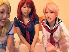 Is there anything better than a lovely Japanese cutie in a schoolgirl outfit? These three cuties are looking stunning with their bright hair. One is blonde, one is a redhead and the other has pink hair. This lucky guy gets sucked and fucked by the cuties. He even gets a titjob.