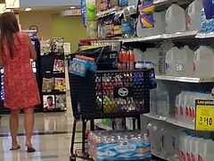 Hot milf in dress at grocery voyeur