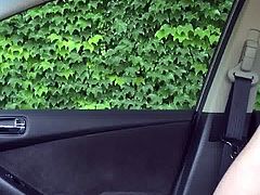 Jerking in car while woman walks by