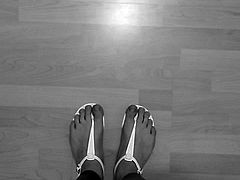 Wearing leggings and white sandals