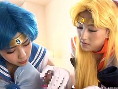 Fanboys of cosplay girls are in heaven, when they get to act out their fantasies. This guy has two beautifully delicate women playing with his body and using their pretty, perfect mouths on his dick, licking and sucking it.