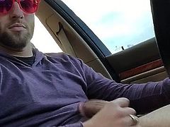 Cute guy jerking off while driving...