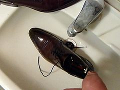 Piss in men's dress shoe