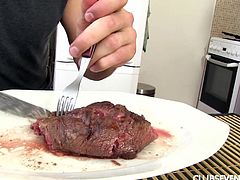 While enjoying his steak, this guy can also admire naughty Claudia's nice buttocks, as the slutty blonde teen has no underwear, just her kitchen robe. Click to watch the playful cooker showing off her other skills: sucking dick, down to the balls! Have fun.