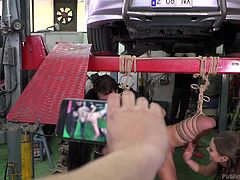 Susy wanted to repair her broken car, but she got into the hands of fraudsters. They caught her, tied her in ropes and decided to have fun. See her hanging in the middle of the garage and sucking some stranger's dick, while surrounding people film her on their phones. Have fun!