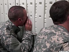 Soldiers in gas masks are in a small room, training for bad situations. They sit as they're supposed to, and even jerk or suck the cocks, that find their way to the other side of the gloryholes around the building.