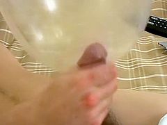 Jeremiah Johnson puts a blown condom on his dick and strokes