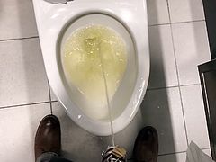 Chastity piss in a public stall