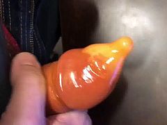 Quick posh wank in an orange condom