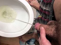 Big hairy cock pissing