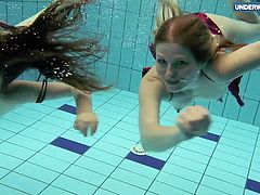 Two super hot teens in the pool